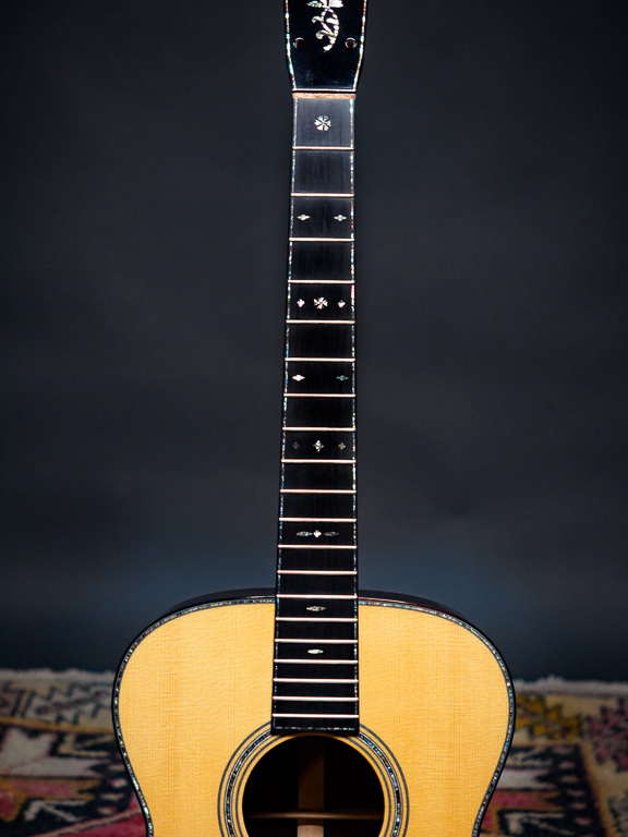 Love the snowflake inlay's and I think they look great with the abalone fingerboard purfling.