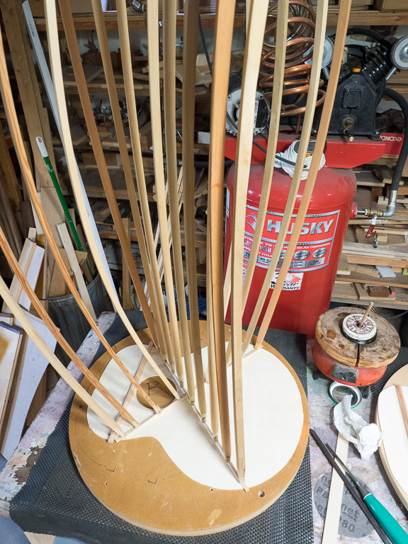 Getting the X brace glued on with hide glue, using the go bars.