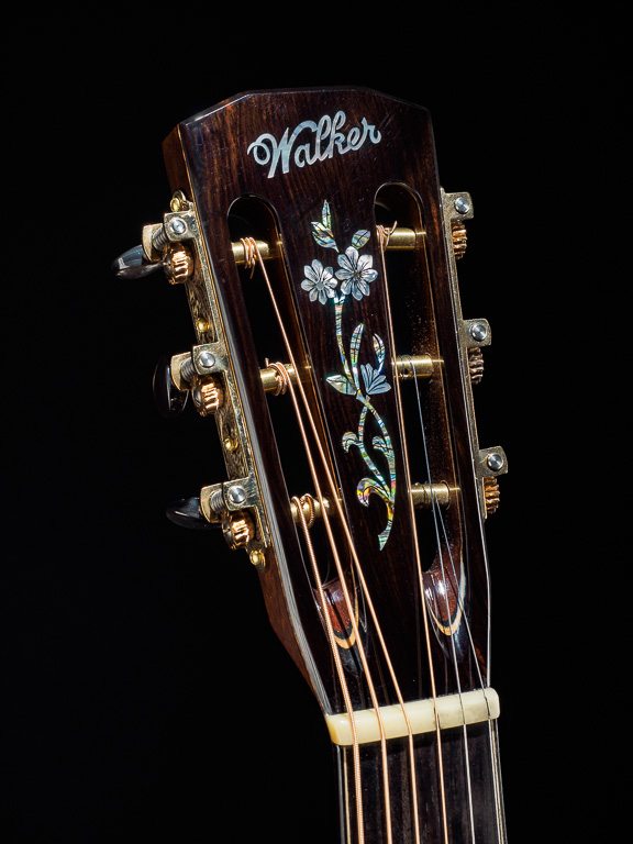 Flower vine inlay proportioned for 12 fret headstock... Ebony overlay... Black mother-of-pearl buttons on Sloan/ Waverly